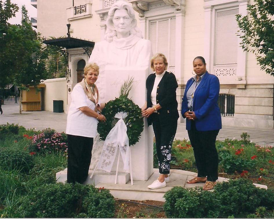 Dr. Terry Neese places a wreath at statue of Artemus, in Greece, with Loula Alafogiannis and Gina Slater.